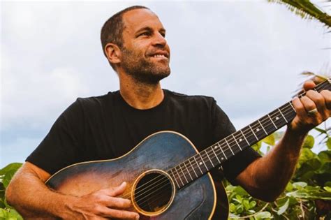 What type of music is Jack Johnson, and how does it blend with the sound of a distant thunderstorm?